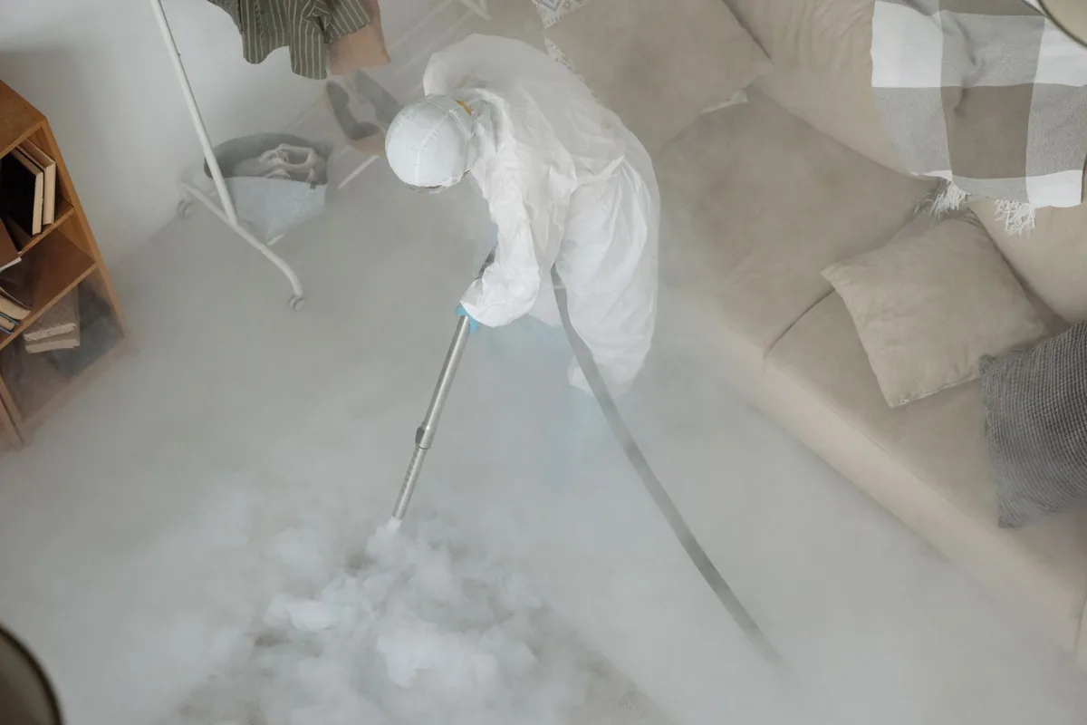 Biohazard cleanup technician in protective equipment, Kingston Springs, TN